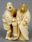 A 19th century Japanese carved ivory netsuke 
Formed as a Samurai and a rat wearing a robe,