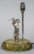 An early 20th century silver plate mounted table lamp 
Formed as a golfer in full swing.