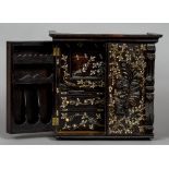 A 19th century Indo-Portuguese ivory inlaid coromandel table cabinet
The twin florally inlaid and