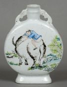 A Chinese porcelain moon flask
Decorated with a boy riding a water buffalo opposing deer and