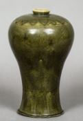 A Korean celadon glazed Maebyong, possibly Koryo Dynasty
Typically decorated.  25.5 cm high.