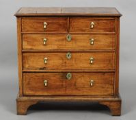 A 18th century line inlaid walnut chest of drawers
The moulded rectangular top above two short and