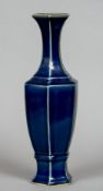 A Chinese porcelain vase
Of hexagonal section with all over blue glaze,