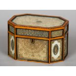 An early 19th century rolled paper tea caddy
Of chamfered rectangular design with glass fronted