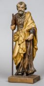 An 18th century carved wooden polychrome decorated model of a saint
Modelled holding a staff and