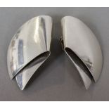 A pair of Georg Jensen silver ear clips, numbered 200
Each 4.5 cm high.