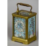 A French brass cased porcelain inset repeating alarm travel clock
The decorated dial with Roman