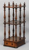 A Victorian rosewood whatnot
Of moulded rectangular form,