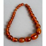 A string of beads, possibly amber
39 cm long.