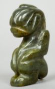 A carved jade pendant
Formed as a mythical beast.  5.75 cm high.