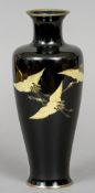 A 19th/20th century Japanese cloisonne vase
Decorated with three cranes in flight on a black ground.