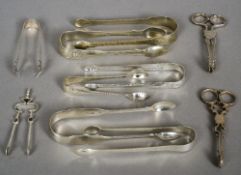 Ten pairs of various Georgian and Victorian silver sugar tongs,