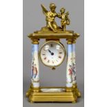 An enamel decorated gilt brass desk clock
The white enamel dial with Roman numerals surmounted with