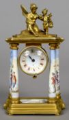 An enamel decorated gilt brass desk clock
The white enamel dial with Roman numerals surmounted with