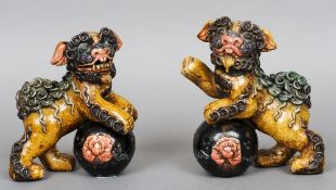 A pair of Chinese pottery temple dogs
Each typically  modelled and polychrome decorated.