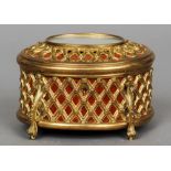 A 19th/20th century gilt metal casket by Tahan, Paris
The oval hinged cover set with a mirror,