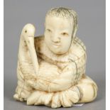 A small Chinese carved ivory group
Worked as  a boy cradling a crane.  4 cm high.