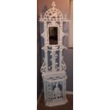 A Victorian cast iron white painted hall stand
Decorated with a huntsman.
