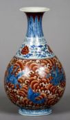 A Chinese porcelain Doucai vase
Of baluster form, decorated with mythical beasts,