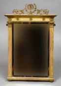 A Regency giltwood framed wall glass
The rectangular plate flanked with fluted columns and