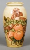 A modern Moorcroft pottery Finches and Fruit vase by Sally Tuffin
Variously marked to base.  18.