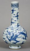 A Chinese blue and white porcelain vase 
Decorated with dragons amongst stylised clouds.