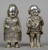 A pair of 800 silver pepperettes
One formed as a young boy with a mandolin,