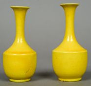 A pair of Chinese porcelain miniature vases
Both with all over yellow glaze.  9 cm high.