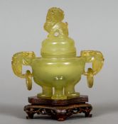 A Chinese carved jade censor and cover
The removable lid with a dog-of-fo finial above twin