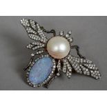 An unmarked gold and silver, diamond, opal and pearl set pendant/brooch
Formed as a butterfly.