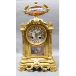 A 19th century Sevres type porcelain inset ormolu cased eight day mantel clock
The porcelain dial