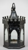 A 19th century painted iron hanging lantern
Of castellated form.  30 cm high.