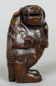 A Chinese carved horn model of a mythical beast
Modelled standing.  12 cm high.