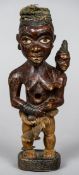 An African tribal fetish figure
Formed as a woman and child.  23.5 cm high.