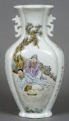 A Chinese porcelain twin handled vase
Of lobed form, decorated with figures playing Go,