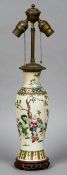 A Chinese porcelain vase
Decorated with children playing in a garden,