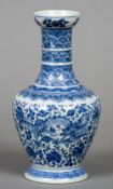 A Chinese porcelain blue and white vase
Decorated with five clawed dragons on a lotus strapwork