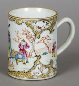 An 18th century Cantonese famille rose tankard
Decorated in the round with figures lighting a