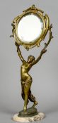 An Art Nouveau bronze vanity mirror
Upheld by a pretty semi-clad maiden,