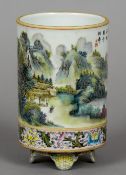 A Chinese porcelain brush pot
Decorated with a mountainous landscape and calligraphic text above a