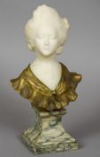 A 19th century bronze and alabaster female figural bust
Modelled with flowers in her hair,