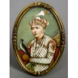 A 19th century Indian miniature portrait of a nobleman holding falcon
Housed in a gilt brass frame.