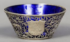 A 19th century Chinese Export silver sugar bowl by Wang Hing
The pierced bowl worked with birds