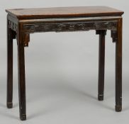 A 19th century Chinese carved hardwood altar table
The cleated rectangular top above the deep