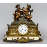 A three piece bronze and white marble clock garniture
The clock mounted with musical putto,