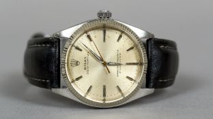 A vintage Rolex steel oyster perpetual gentleman's wristwatch
With silvered dial.  3.5 cm wide.