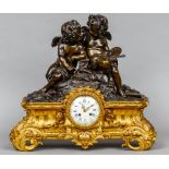 A gilt metal bronze mounted mantel clock, retailed by Clermont,
