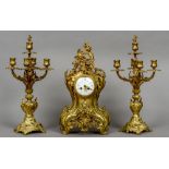 A gilt bronze three piece clock garniture in the rococo style
The clock 50 cm high.