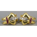 A pair of contemporary 18 ct gold diamond and ruby set ear clips
Each 1.5 cm high.