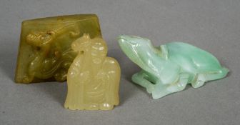 A Chinese carved jade pendant
One side decorated with a dragon;